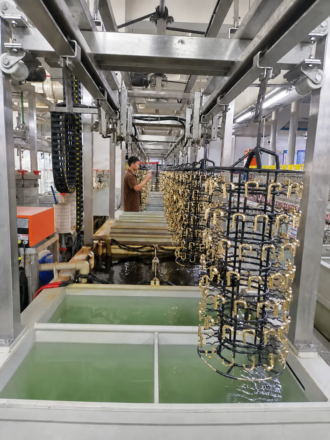 Components moving into a process tank on the automated line
